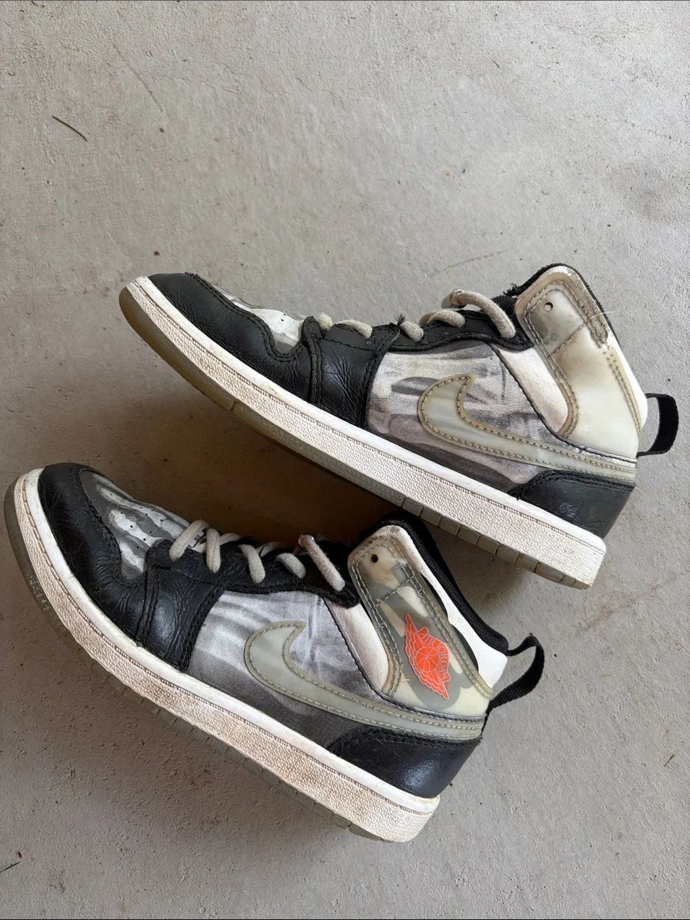 Nike Kids Black and White High-Top Sneakers with Orange Logo